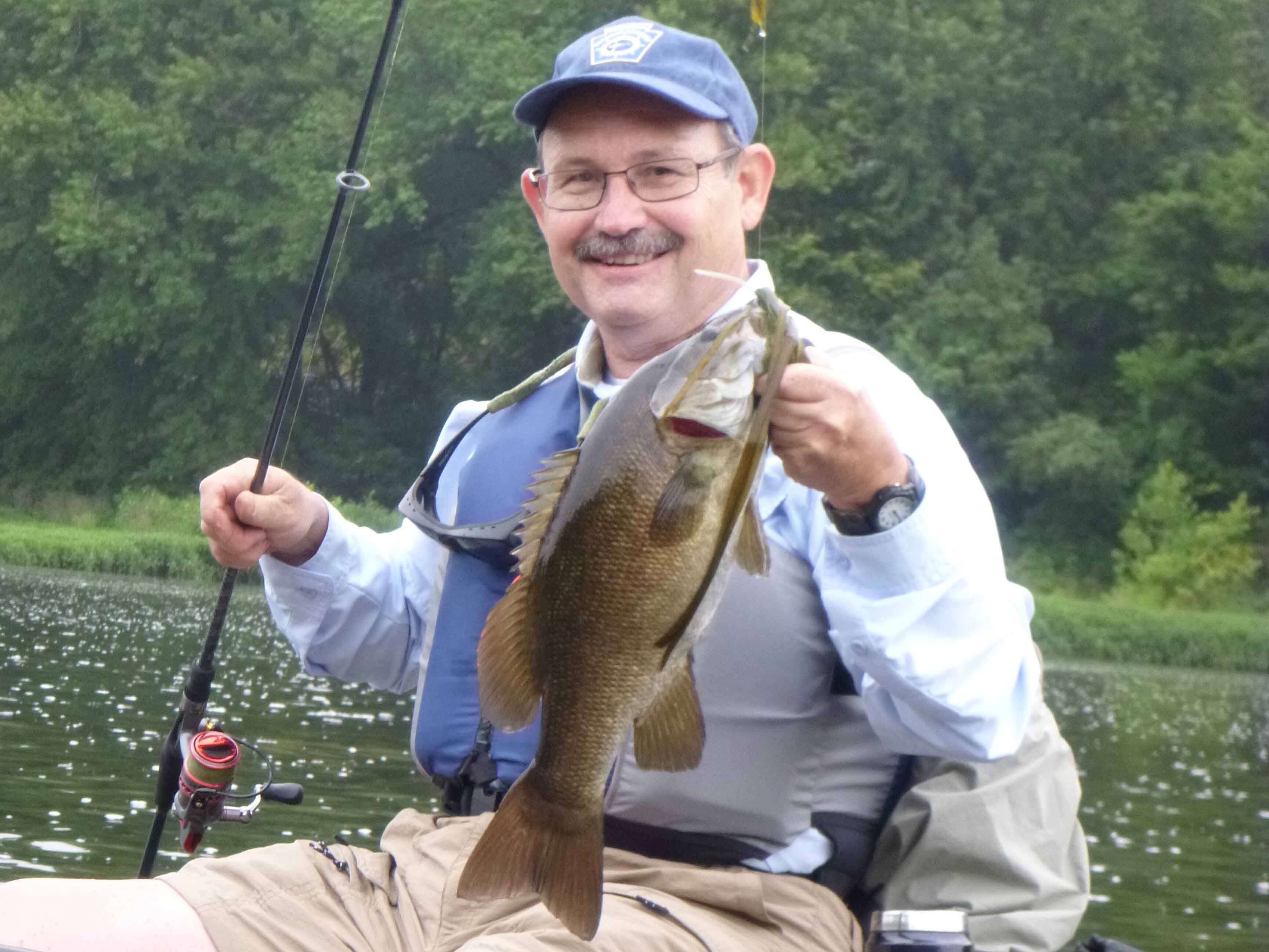 John Arway with a smallmouth bass.