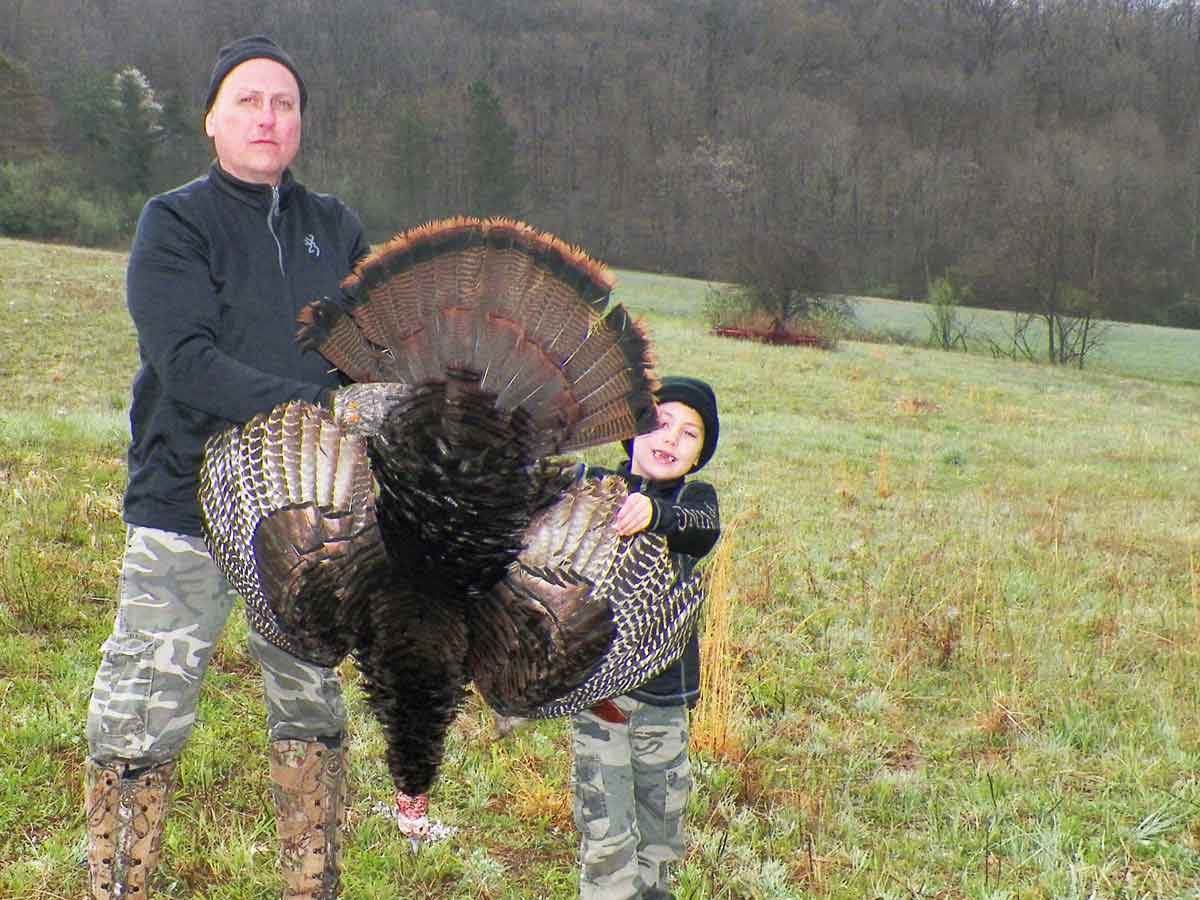 A young hunter with his first gobbler.